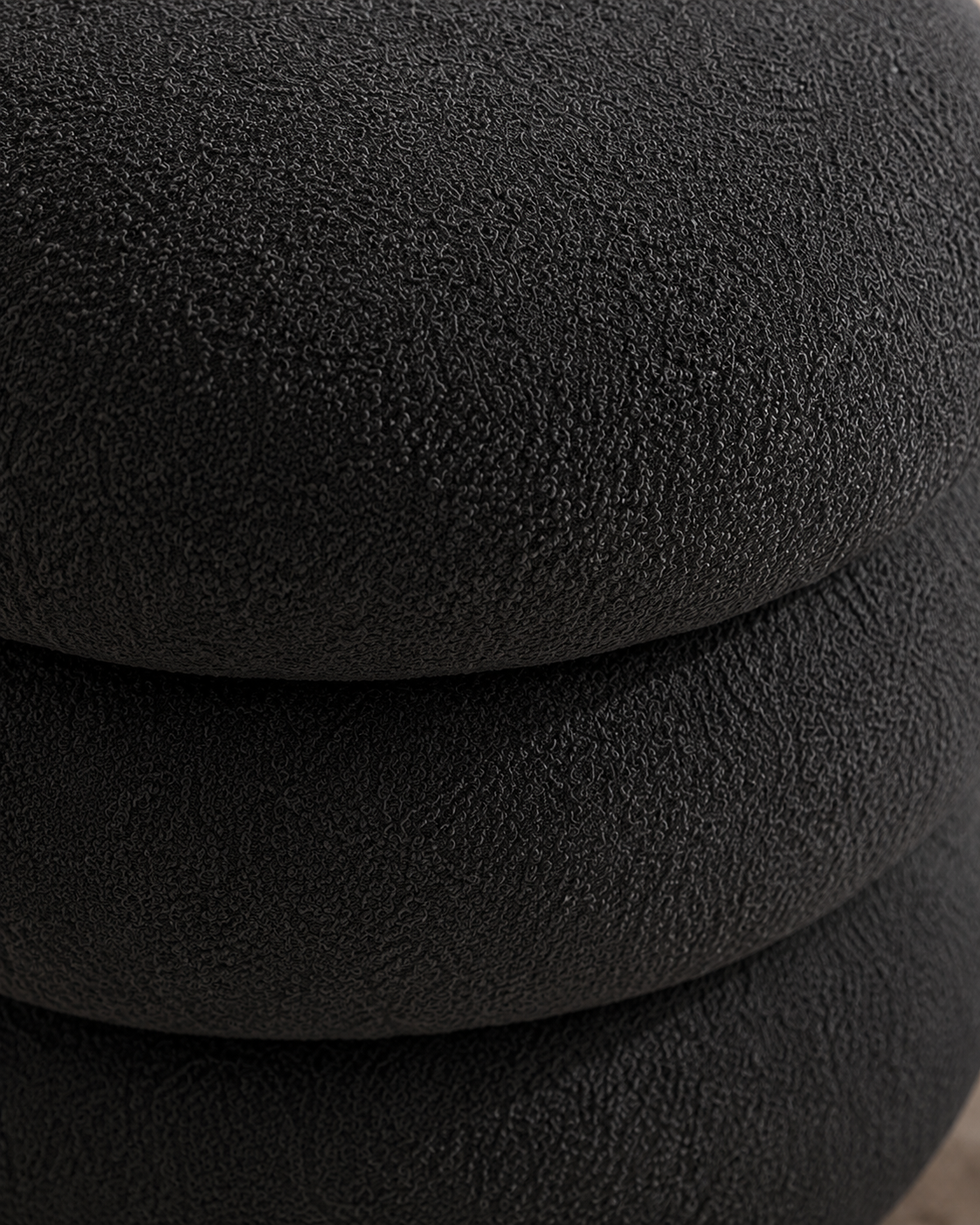 Tiered round stool in charcoal, styled in a room